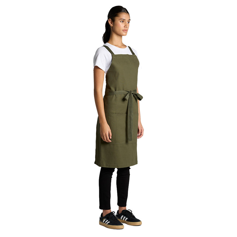 Load image into Gallery viewer, AS Colour 1082 Carrie Apron featuring heavy-weight 320 GSM cotton canvas, herringbone cross over shoulder strap, metal eyelets, and a spacious front patch pocket with top stitch detailing. Ideal for workplace safety.