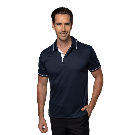 Cottesloe Mens Polo Shirt, modeled by a smiling man, features a jacquard knitted collar and cuff with contrast stripe, mesh knit, and side vents for enhanced movement, ideal for smart casual or uniform wear.