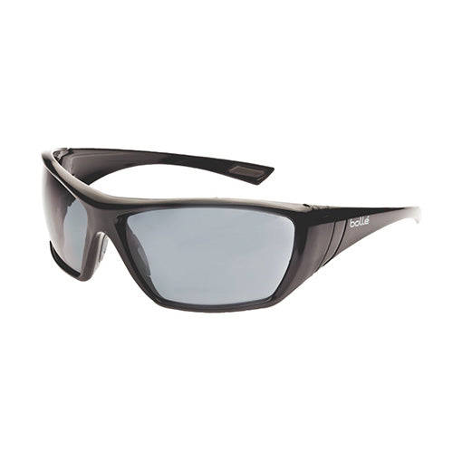 Bolle Hustler Safety Glasses: Smoke, featuring sleek black frames and grey lenses, designed with rubber nose pads and EVA temple tips for a secure, comfortable fit, ideal for workplace safety.