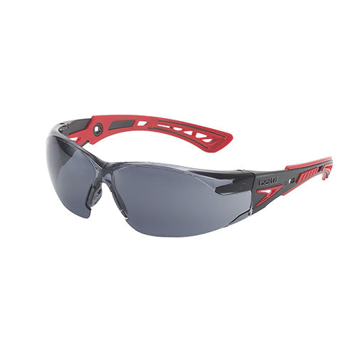 Bolle Rush+ Safety Glasses: Smoke, showcasing an ultra-sporty design with flexible, co-injected temples and an adjustable, non-slip nose bridge, ideal for active safety enthusiasts seeking lightweight eye protection.