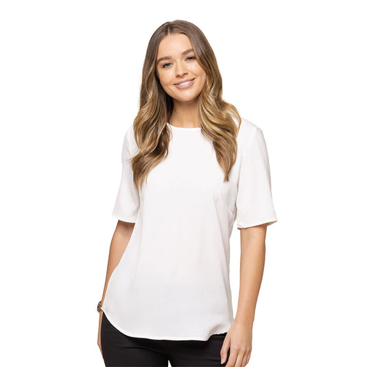 Taylor Short Sleeve Soft Top: A woman wearing a soft top with a short sleeve design, featuring luxe twill fabric and exposed zip at the back, ideal for casual or workplace settings.