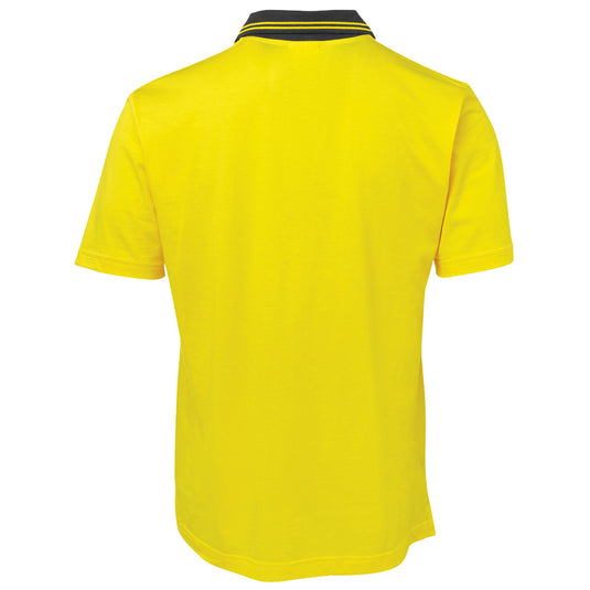 JB's Hi Vis Short Sleeve Cotton Polo features a classic fit with contrast striped collar and reinforced chest pocket, ideal for workplace safety. Certified for UPF 50+ protection, suitable for day use.