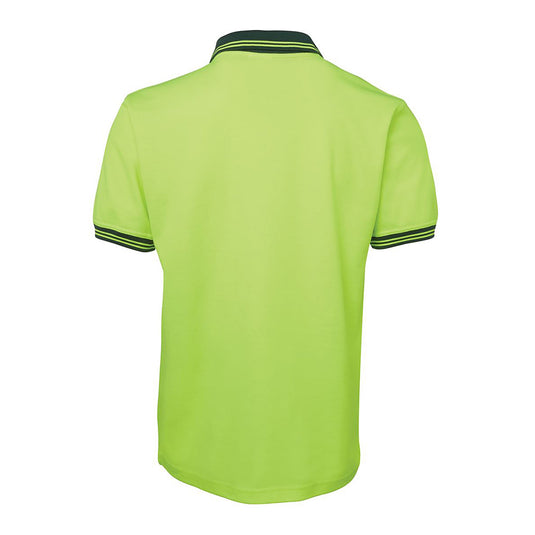 JB's Hi Vis Cotton Back Polo features a classic fit with a reinforced chest pocket and pen insert, designed with Dri™ fabric for moisture-wicking comfort, ideal for safety-conscious workplaces.