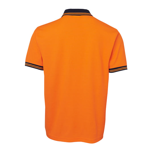 JB's Hi Vis Cotton Back Polo, featuring a classic fit with a reinforced chest pocket and pen insert, showcases JB's Dri™ moisture-wicking fabric, ensuring comfort and durability for workplace safety.