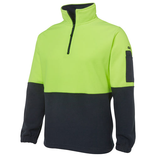 JB’s Hi Vis Half Zip Polar Fleece features a durable design with contrast panels on sleeves and lower front, elastic hem with toggles, and multiple pockets, ideal for workplace safety and comfort.