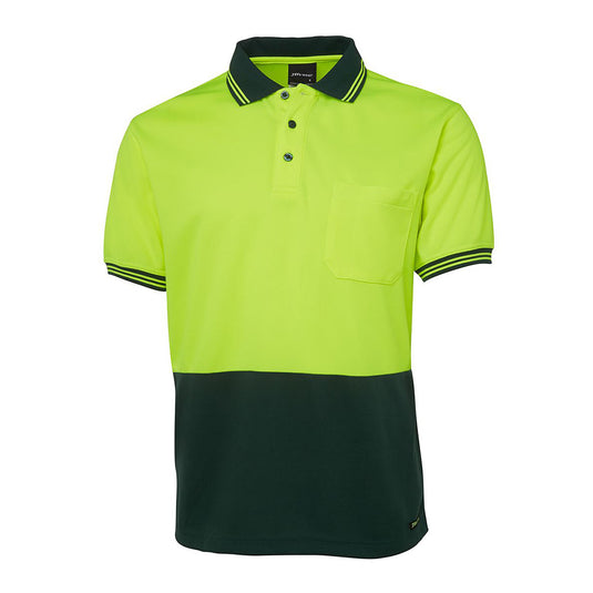JB's Hi Vis Traditional Polo Shirt features a classic fit with a reinforced chest pocket and pen insert, crafted from moisture-wicking micro mesh fabric, ideal for keeping cool and dry during active work.
