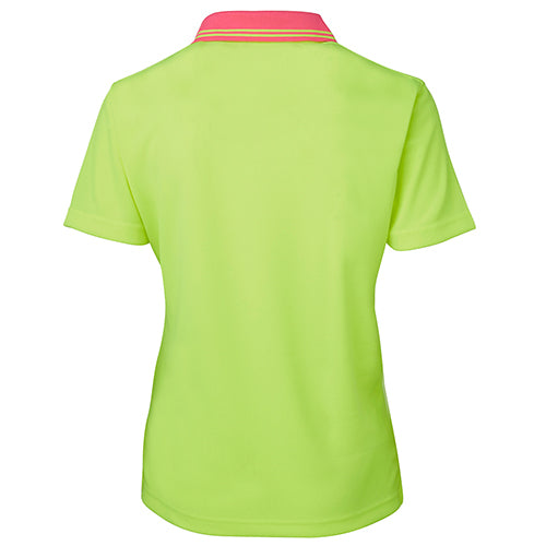 Load image into Gallery viewer, JB's Ladies Hi Vis Comfort S/S Polo Shirt displayed on a mannequin, featuring moisture-wicking micro mesh fabric, a reinforced chest pocket with pen insert, and a straight hem with side splits.