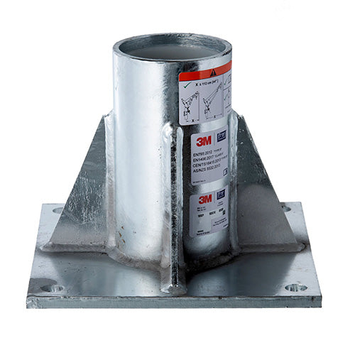 3M DBI-SALA HC Floor Mount Base, a galvanized steel cylinder with a label, designed for secure installation on surfaces, featuring integrated mounting holes for M20 fasteners, suitable for confined space safety systems.
