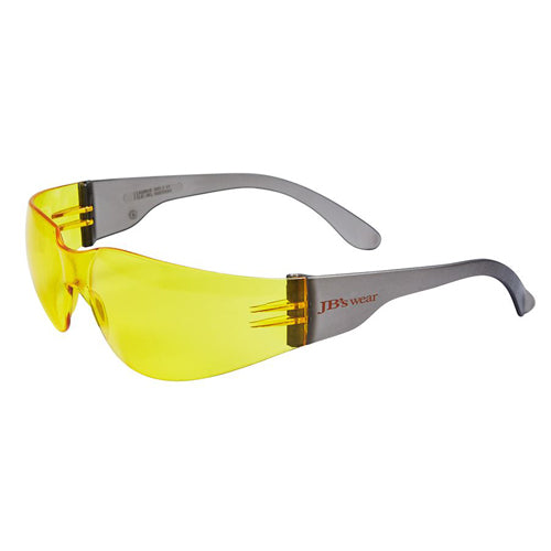 JB's Saver Spec: Amber, a pair of anti-scratch, UV400 safety glasses with a wrap-around design, rimless polycarbonate frame, and one-piece lens for unobstructed vision, suitable for diverse face shapes.