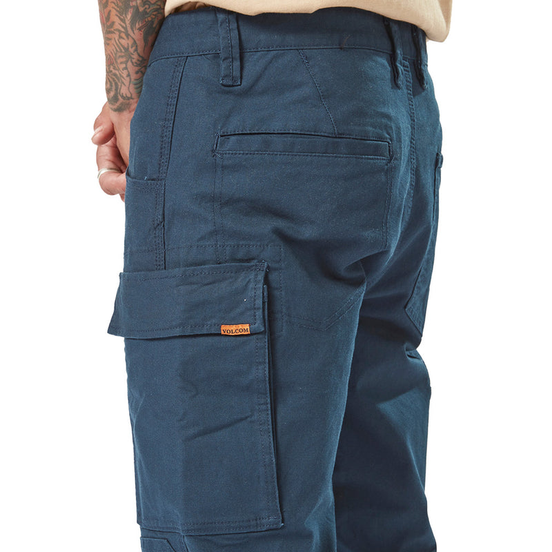 Load image into Gallery viewer, Volcom Workwear Caliper Pant worn by a person, showcasing durable design with dual entry cargo pocket and reinforced knees, ideal for active safety and work environments.