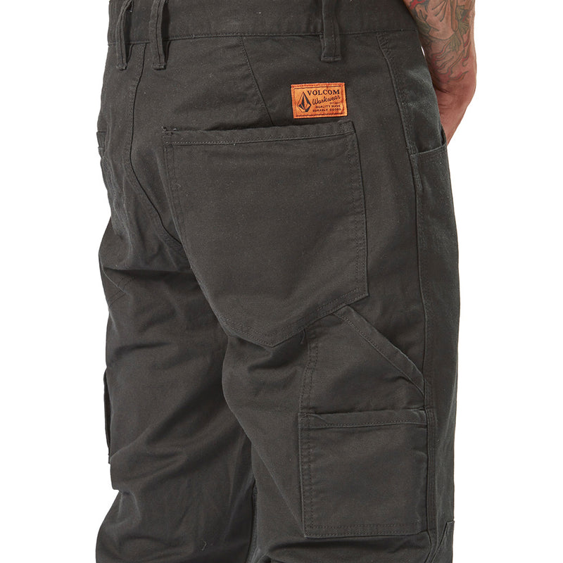 Load image into Gallery viewer, Volcom Workwear Caliper Cuffed Pant showcasing a modern fit with elastic cuffs and reinforced features, highlighting durability and utility pockets, ideal for active work environments.