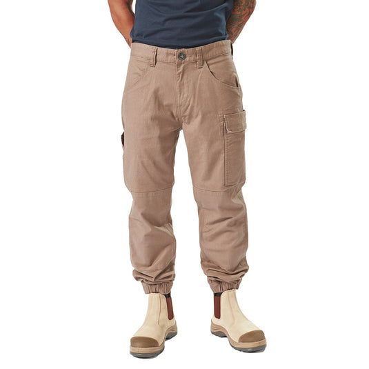 Volcom Workwear Caliper Cuffed Pant showcased on a man, highlighting its durable design with dual entry cargo pocket and reinforced knees, embodying Active Safety's commitment to quality workwear.