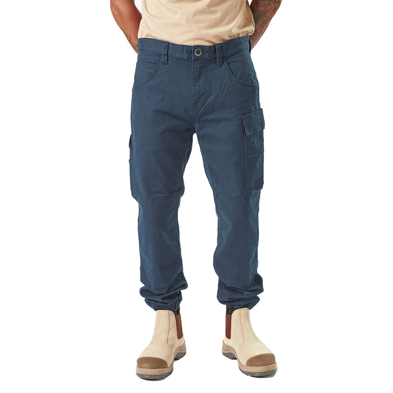 Load image into Gallery viewer, Volcom Workwear Caliper Cuffed Pant featuring durable design with reinforced knees and multiple utility pockets, ideal for active safety environments. Modeled by a person standing, showcasing comfort elastic cuffs.