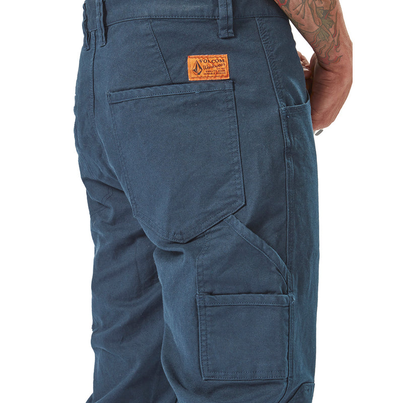 Load image into Gallery viewer, Volcom Workwear Caliper Cuffed Pant, showcasing the back pocket with a logo, emphasizing durability and style with reinforced stitching and utility features, ideal for active and safety-focused work environments.