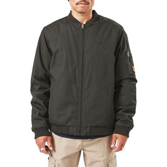 Volcom Workwear Water Resistant Bomber Jacket, featuring a waist-length design with a brushed tricot lining and zippered sleeve pocket, worn by a man showcasing its durability and unique style.