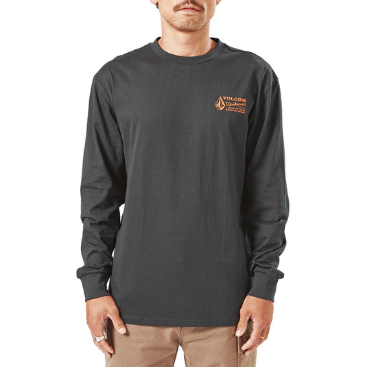 Volcom Workwear Long Sleeve Tee on a man with a mustache, showcasing the modern fit and durability. Features soft hand screenprint and exterior woven label, embodying creative liberation and functionality.