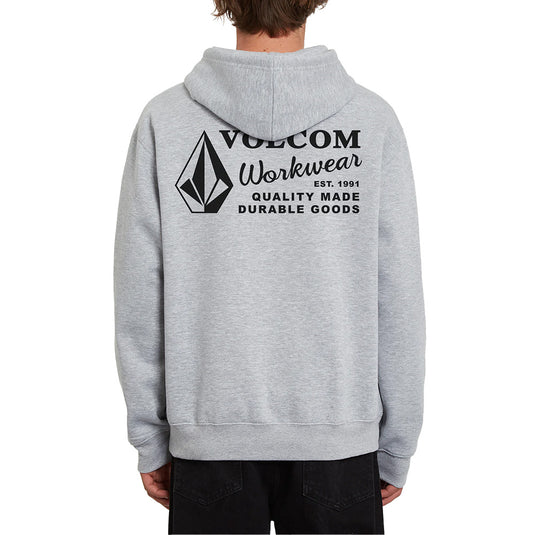Volcom Workwear Pullover Fleece Hoodie worn by a person, featuring a black diamond logo and black text on the front, showcasing its durable design and lined hood, ideal for active work environments.
