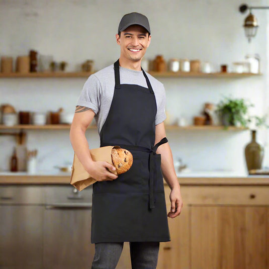 Biz Barley Apron in classic bib style with an adjustable neck strap, durable no-fade canvas, reinforced herringbone straps, and a large split front pocket, suitable for uniform and commercial use.