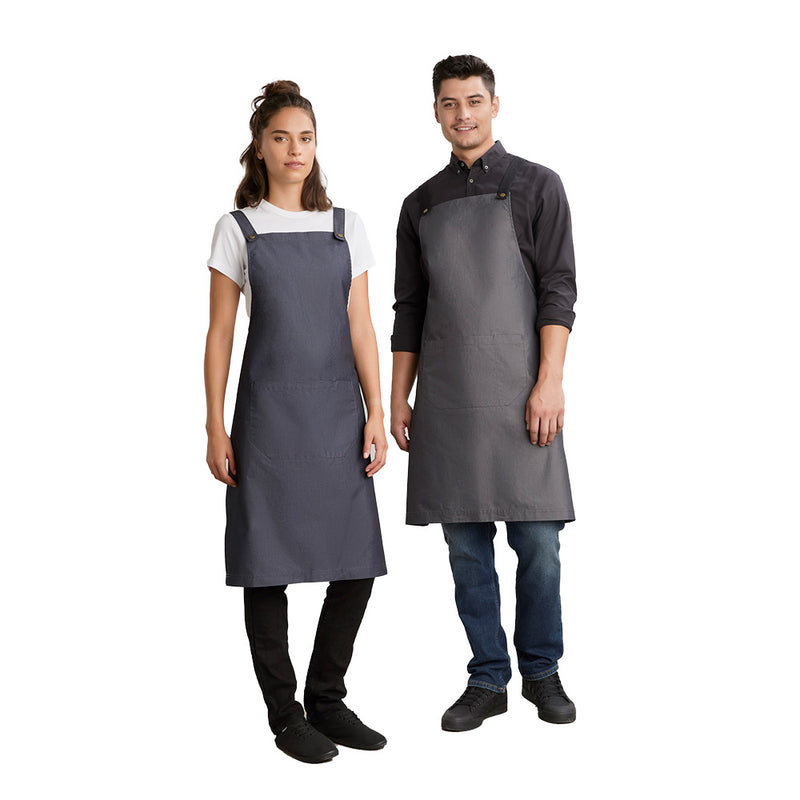 Load image into Gallery viewer, Biz Urban Bib Apron worn by a man and woman, featuring a divided front pocket, removable x-back straps, and reinforced stitching, ideal for workplace settings.