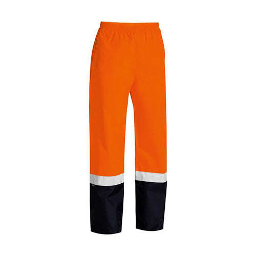 Bisley Hi Vis Taped Rain Trouser featuring waterproof, breathable fabric with reflective tape around the lower leg, a full elasticated waistband, and adjustable hems, ideal for safety in wet conditions.