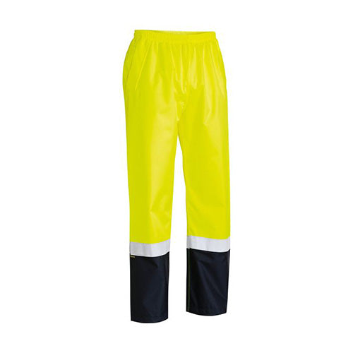 Bisley Hi Vis Taped Rain Trouser, featuring reflective tape on the lower leg, elastic waistband, and adjustable hems, designed for safety and comfort with waterproof, breathable fabric, ideal for workplace safety needs.