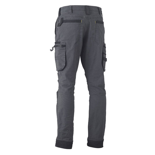 Bisley Flex & Move Utility Zip Cargo Pants showcasing rear view with zippered thigh pockets, reinforced Kevlar® knee patches, articulated seams, and adjustable ankle tabs, ideal for durable workplace wear.