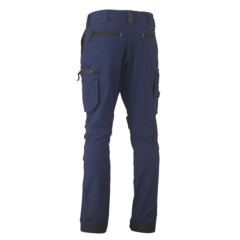 Load image into Gallery viewer, Bisley Flex & Move Utility Zip Cargo Pants feature back view with multiple pockets, reinforced knee panels, and contrast Kevlar® patches. Designed for durability and comfort with a tapered straight-leg cut and belt loops.
