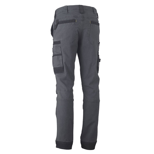 Bisley Flex & Move Stretch Utility Cargo Pants featuring a close-up of multifunctional pockets, contoured leg design, and durable Cordura® reinforcements, ideal for workplace safety and mobility.