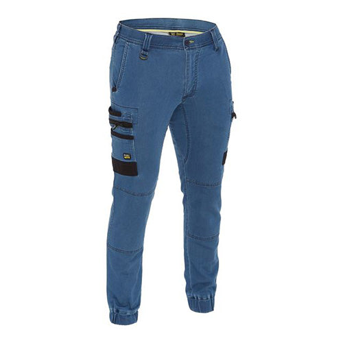 Load image into Gallery viewer, Bisley Stretch Denim Cargo Cuffed Pants featuring black pockets, durable double-layer knees, and oversized cargo pockets. Designed for comfort and utility with Cordura® highlights and a crotch gusset for added durability.