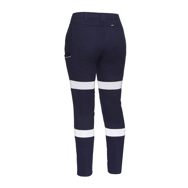 Load image into Gallery viewer, Bisley Women's Taped Stretch Cotton Pants showcasing a back view, highlighting reflective biomotion tape and multiple pockets, ideal for safety and workwear environments.