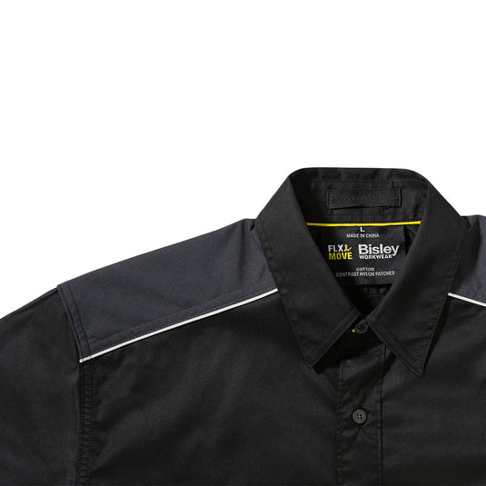 Close-up of the Bisley Flex & Move Mechanical Stretch Shirt, highlighting the two-piece structured collar and touch tape chest pockets, designed for comfort and durability with reflective piping for safety.