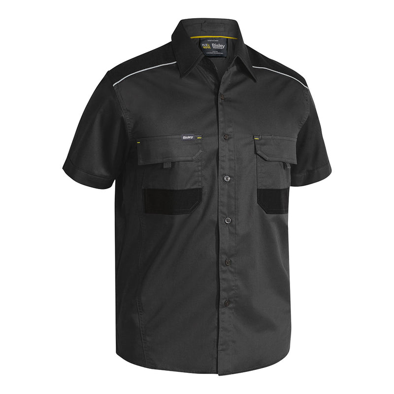 Load image into Gallery viewer, Bisley Flex & Move Mechanical Stretch Shirt showcasing reflective cord piping, two mitred chest pockets with touch tape closure, and a structured collar, designed for comfort and durability with mechanical stretch fabric.