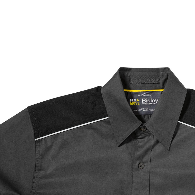 Load image into Gallery viewer, Close-up of the Bisley Flex & Move Mechanical Stretch Shirt, showcasing the structured collar and chest pockets with touch tape closure, ideal for safety and comfort in active work environments.