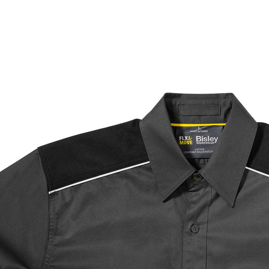Close-up of the Bisley Flex & Move Mechanical Stretch Shirt, showcasing the structured collar and chest pockets with touch tape closure, ideal for safety and comfort in active work environments.