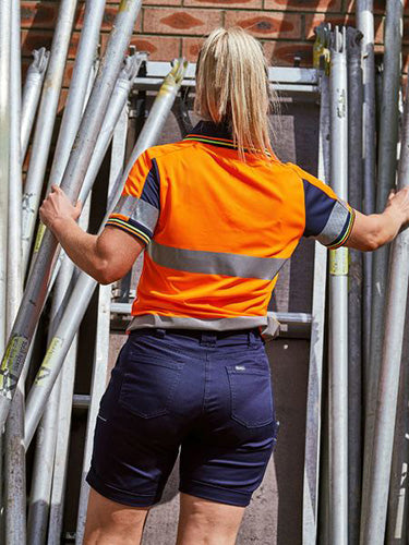 Bisley Women’s Stretch Cotton Short with a mid-rise fit, angled side pockets, cargo welt pockets, and cuffed hem, designed for comfort and movement, suitable for active work environments.