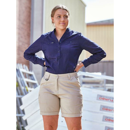 Bisley Women’s Stretch Cotton Short featuring a mid-rise fit with hands in pockets, showcasing angled side pockets and cuffed hems, ideal for active work environments.