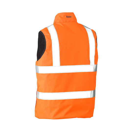 Bisley Taped Reversible Puffer Vest featuring reflective stripes and high-visibility, designed for safety. Displays a reversible style with a quilted finish, emphasizing its functionality in workwear environments.