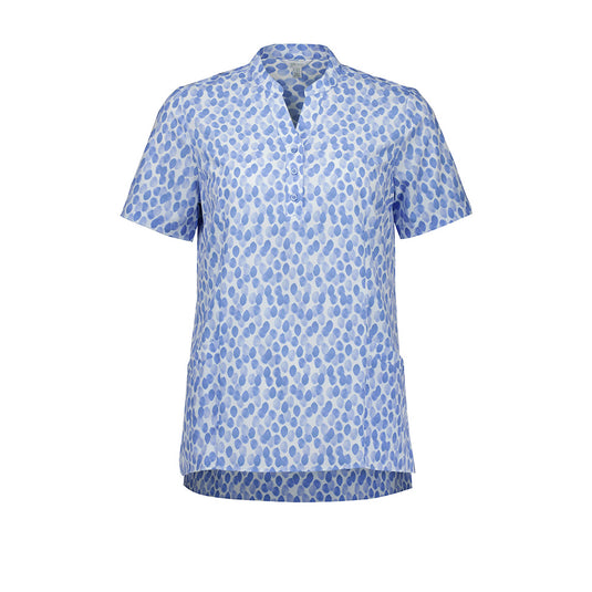 Biz Womens Florence Stardust Print Tunic, features a Y-neck with mandarin collar, side splits, durable deep pockets, and triangle sleeve cut-outs, offering style and comfort for diverse workplace environments.
