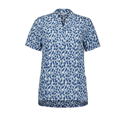 Biz Womens Florence Stardust Print Tunic showcases a flattering Y-neck mandarin collar and triangle sleeve cut-outs, featuring a straight longer back hem, side splits, and durable front pockets for functional elegance.