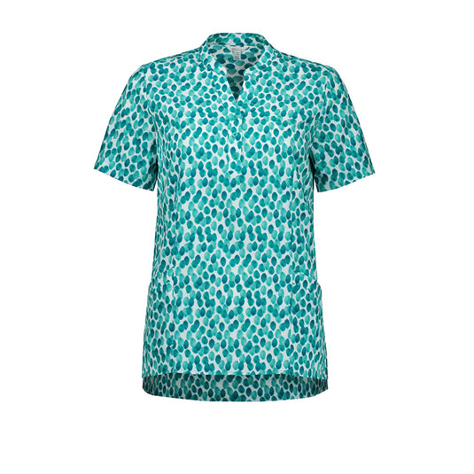 Biz Womens Florence Stardust Print Tunic featuring a flattering Y-neck and mandarin collar, two durable front pockets, side splits, and triangle cut-out sleeves, designed for comfort and versatile movement.