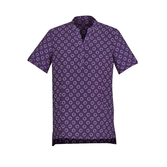 Biz Womens Florence Daisy Print Tunic features a purple shirt with white circular patterns, designed with a stylish collar and sleeves. Ideal for comfort and functionality, it suits various climates and workplace settings.
