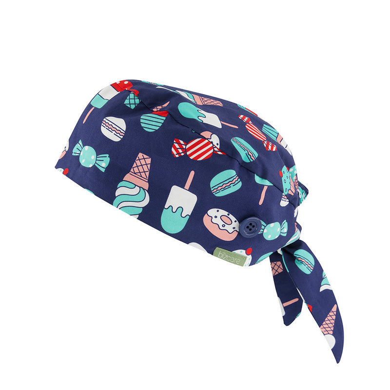 Load image into Gallery viewer, Biz Unisex Printed Scrub Cap designed with elastic back and tie for easy fit over buns, featuring side buttons for mask attachment. Made from breathable 100% cotton for comfort.