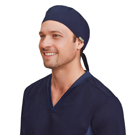 Biz Unisex Reversible Scrub Cap with elastic back and tie, designed to fit over buns. Made from a cotton-polyester blend with antibacterial protection, ideal for industrial laundering, reflecting Active Safety's commitment to quality workwear.