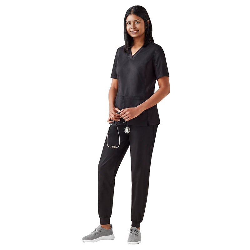 Load image into Gallery viewer, Biz Womens Riley Slim Leg Jogger Scrub Pant showcased on a woman in black scrubs, holding a stethoscope, highlighting the pants' tapered design and functional pockets, blending comfort with professional style.