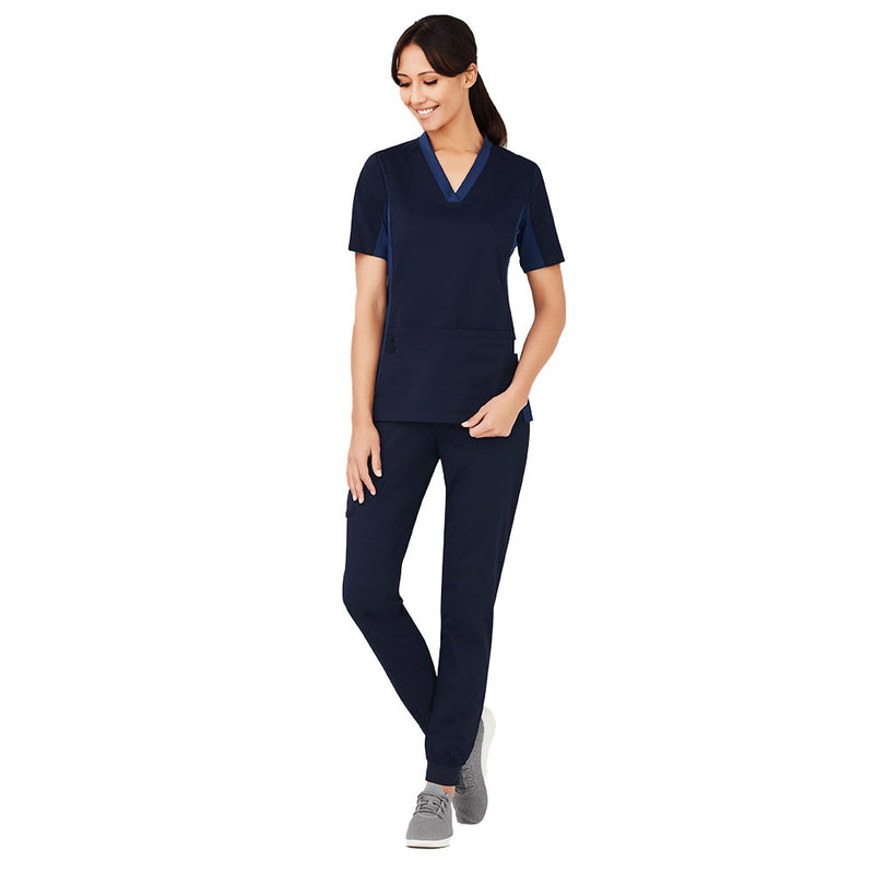 Load image into Gallery viewer, Biz Womens Riley Slim Leg Jogger Scrub Pant worn by a woman; features a comfortable yoga-style waistband, tapered leg design, and functional cargo pockets, ideal for healthcare professionals seeking durability and style.
