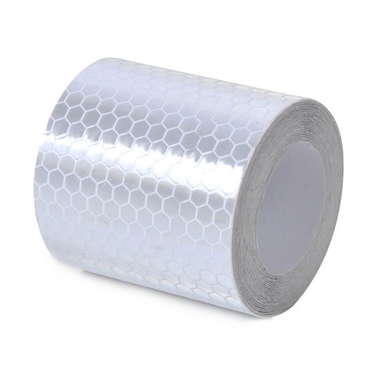 Reflective Conspicuity Tape, White: 1m roll shown in a close-up, highlighting its cylindrical shape. Ideal for enhancing visibility and safety, aligning with Active Safety's focus on protective gear and workplace supplies.