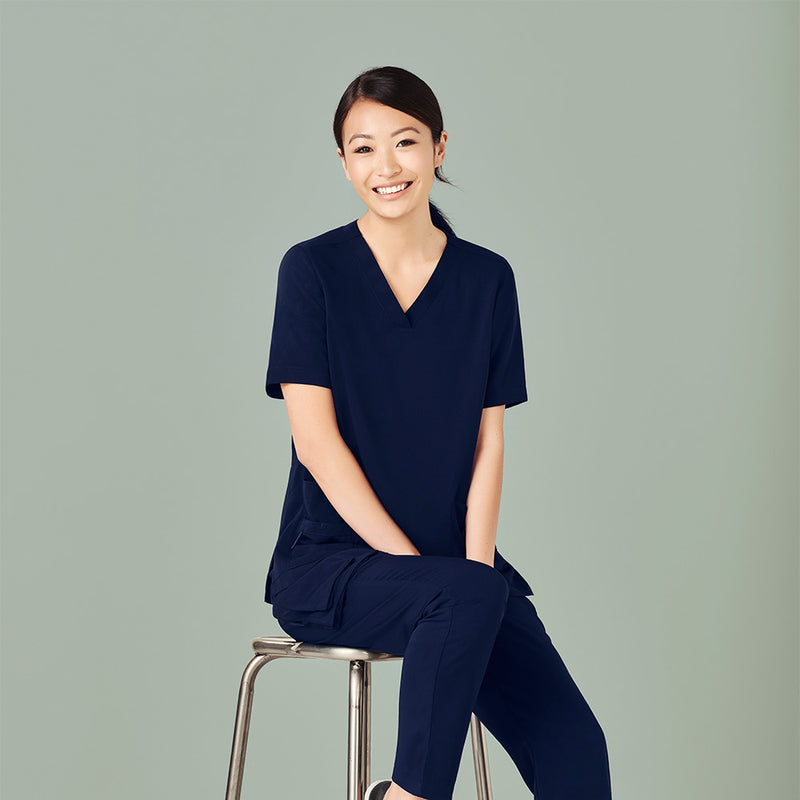 Load image into Gallery viewer, Bizcare Womens Avery V Neck Scrub Top, featuring a soft, durable, easy-care fabric with five pockets, utility loops, and a bungee loop, designed for comfort and functionality in demanding environments.