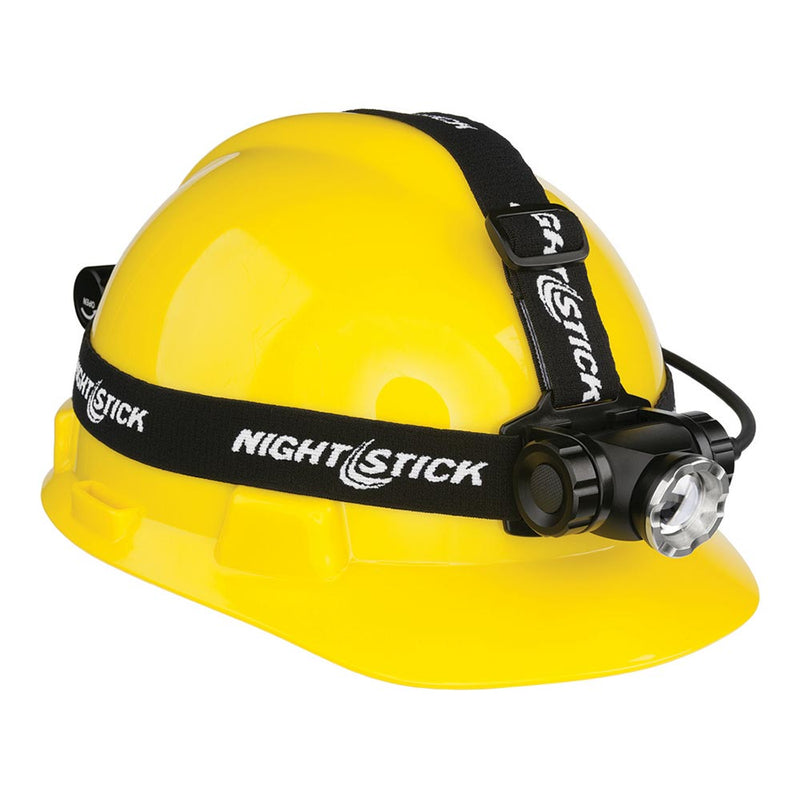 Load image into Gallery viewer, Nightstick Dual-Light Recharge Headlamp mounted on a yellow safety hard-hat, featuring an adjustable ratchet tilt head, elastic strap, and side switch for easy mode changes; ideal for workplace safety.