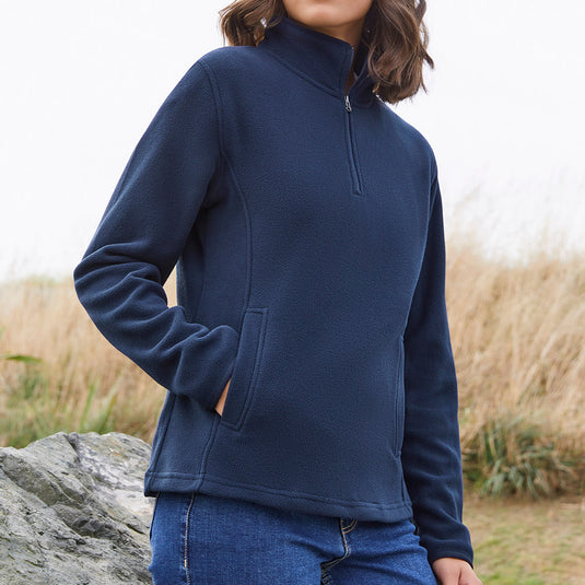 Biz Ladies Trinity 1/2 Zip Pullover, featuring a modern fit, high zip collar, and concealed pockets, ideal for workplace comfort and safety. Crafted from lightweight, low-pill micro fleece for warmth.
