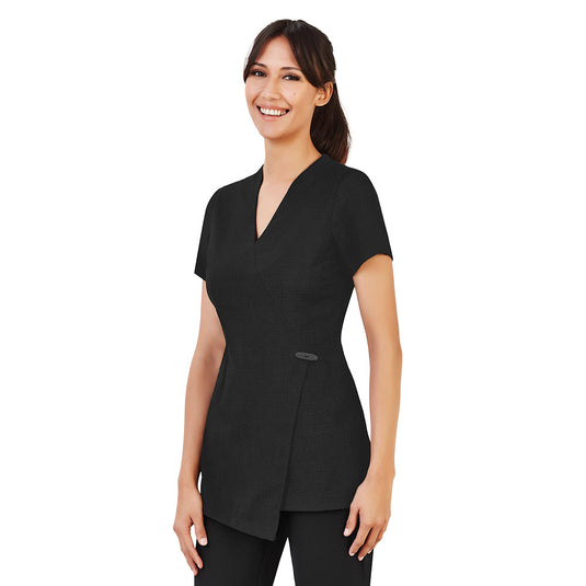 Biz Womens Spa Tunic features an elegant asymmetrical mock-wrap front with horn-button detail. Made from premium stretch fabric with a linen-like look, it includes a practical invisible back zip and side splits.